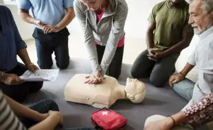 group diverse people cpr training class